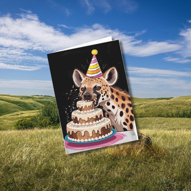Spotted hyena wearing hat biting into cake card (Creator Uploaded)