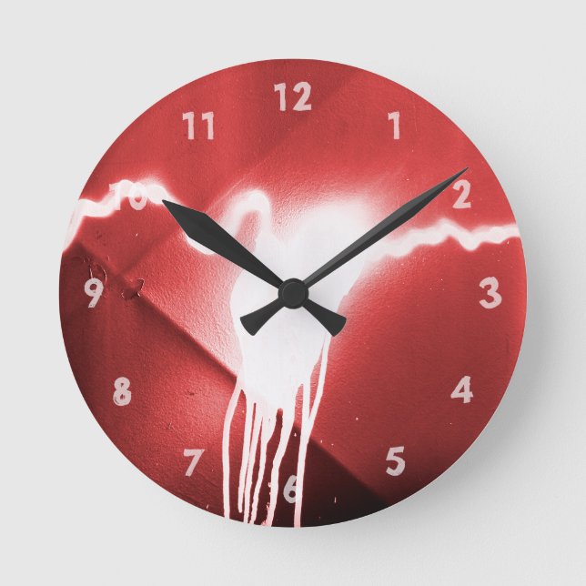 Sprayed graffiti on red metal round clock (Front)