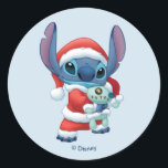 Spread Christmas Cheer with Lilo & Stitch! Classic Round Sticker<br><div class="desc">Get into the holiday spirit with this adorable Lilo & Stitch sticker, featuring Stitch dressed up as Santa Claus. This festive sticker is perfect for adding a touch of joy to laptops, water bottles, and other belongings. It's officially licensed Disney merchandise, so you know it's high quality and sure to...</div>