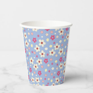 spring flowers on blue background paper cups