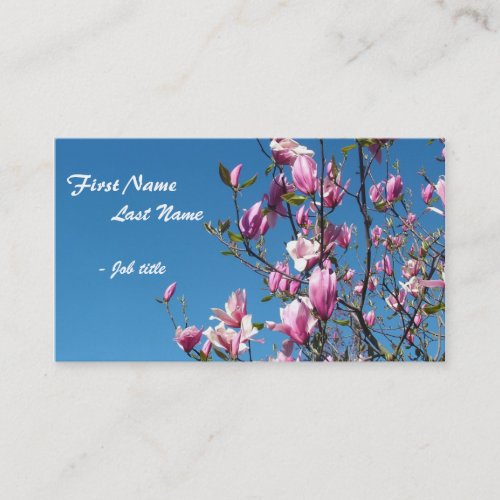Spring pink magnolia flowers in blue sky business card