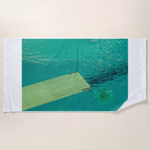 springboard dive on beach towels