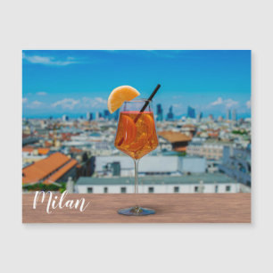 Spritz cocktail on a table with view of Milan