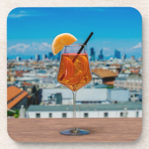 Spritz cocktail on a table with view of Milan Beverage Coaster