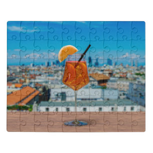 Spritz cocktail on a table with view of Milan Jigsaw Puzzle