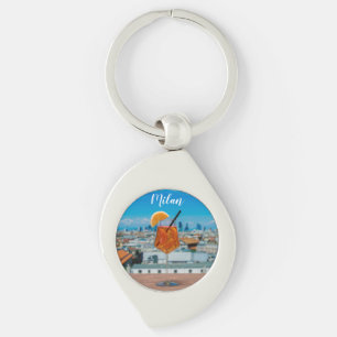 Spritz cocktail on a table with view of Milan Keychain
