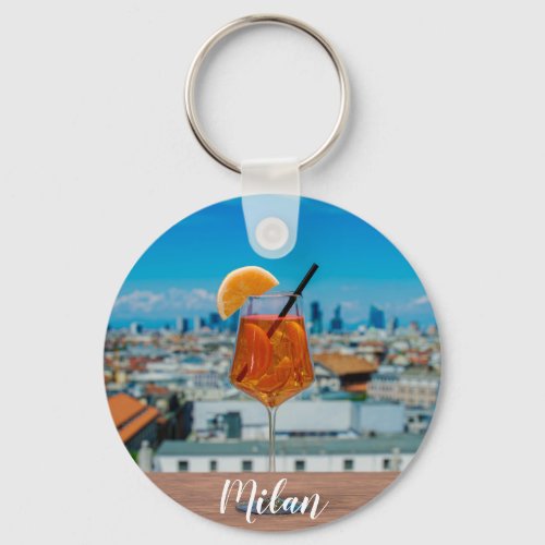 Spritz cocktail on a table with view of Milan Keychain