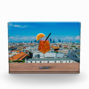 Spritz cocktail on a table with view of Milan Photo Block