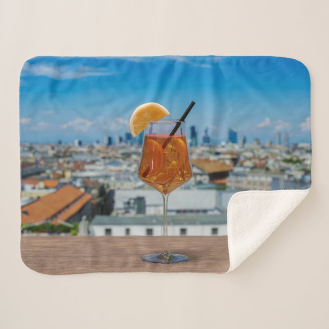 Spritz cocktail on a table with view of Milan Sherpa Blanket (Front (Horizontal))