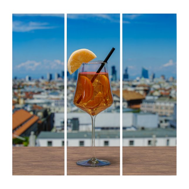 Spritz cocktail on a table with view of Milan Triptych (Front)