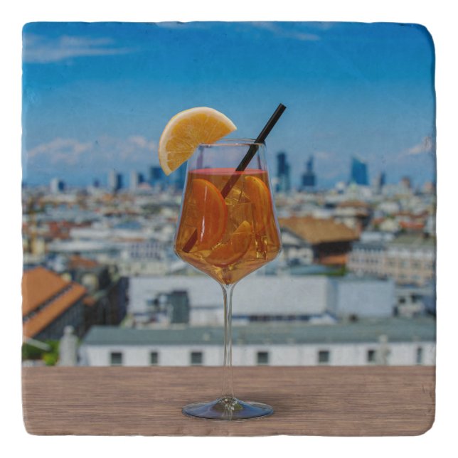 Spritz cocktail on a table with view of Milan Trivet (Front)