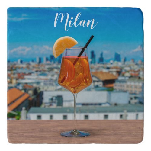 Spritz cocktail on a table with view of Milan Trivet