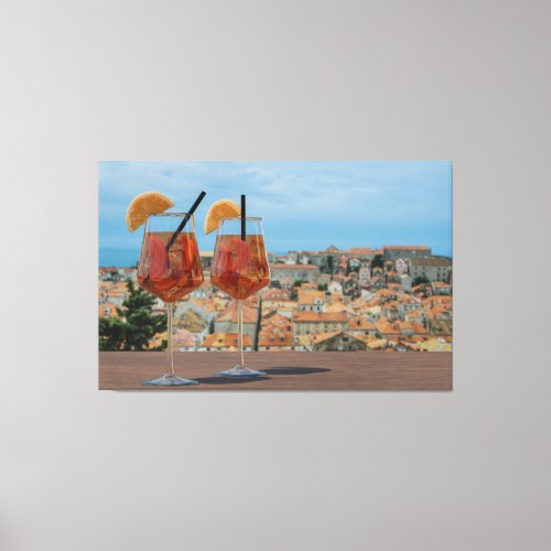 Spritz cocktails against red roofs in Dubrovnik Canvas Print