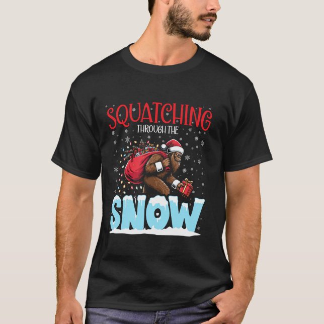Squatching Through the Snow Christmas Bigfoot Funn T-Shirt (Front)