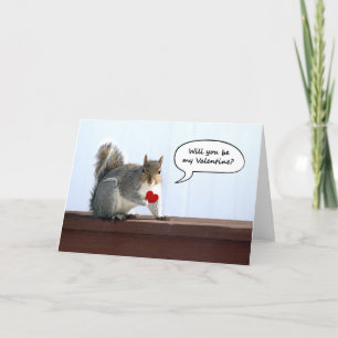 Squirrel holding red heart Valentine greeting card