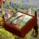 St Clare of Assisi Watering Flowers (M 065) Gift Box<br><div class="desc">Franciscan Spirituality has its origin in the life and thought of St. Francis of Assisi (1181/1182-1226), composer of the Canticle of the Sun. Among its principles are an emphasis on responsible stewardship for the environment and a deep belief in the interconnectedness of man and nature as reflections of God, the...</div>