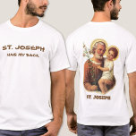 St. Joseph has my back T-Shirt<br><div class="desc">A beautiful traditional image of St. Joseph holding the Child Jesus with lilies on the back. Humorous text on the front. 
The text and font below may be modified.</div>