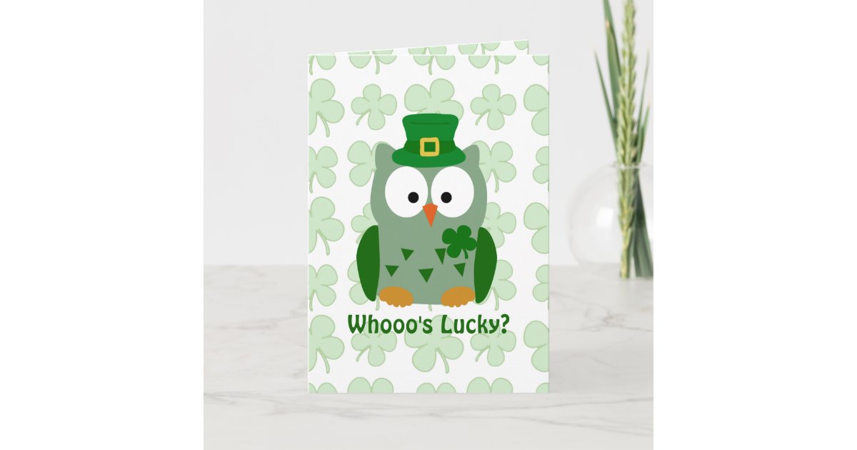 Wise owl with lucky four-leaf clover