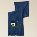 Stachy the Snowman Scarf<br><div class="desc">An image of the head and shoulders of a snowman. He has two black eyes, a carrot for a nose, a big black mustache and is wearing a black hat and a green scarf that is blowing in the wind. Snowflakes are falling in the background.</div>