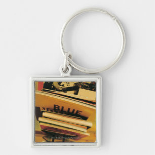 Stack of books and magazines keychain