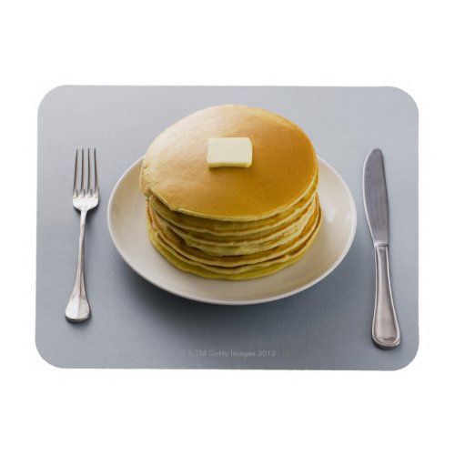 Stack of pancakes with butter on a plate magnet