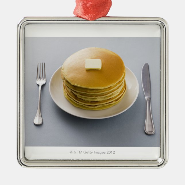 Stack of pancakes with butter on a plate metal ornament (Front)