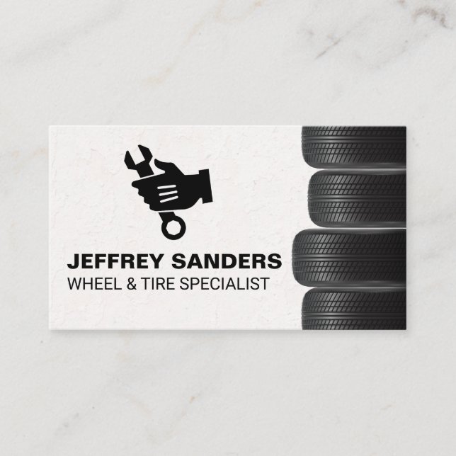 Stacked Tires | Mechanic Holding Wrench Logo Business Card (Front)