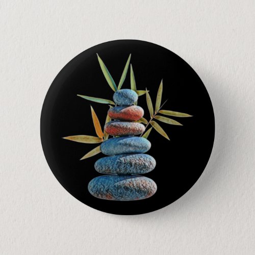 Stacked zen stones in balance with bamboo leaves  button