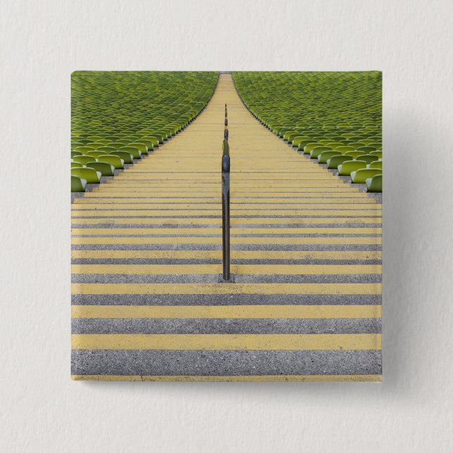 Stadium stairway between rows of green seats button (Front)