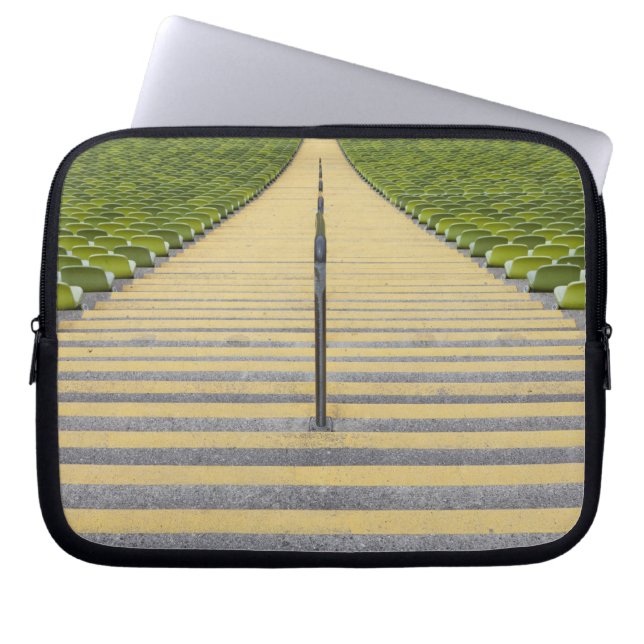 Stadium stairway between rows of green seats laptop sleeve (Front)