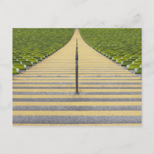 Stadium stairway between rows of green seats postcard