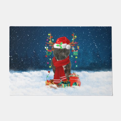 Staffordshire Bull Terrier in Snow with Christmas Doormat