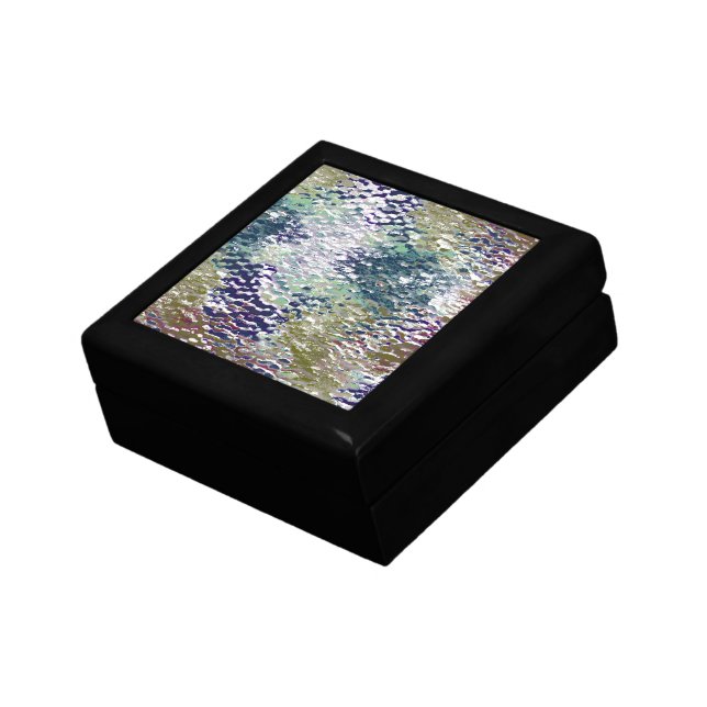 Stains and splatters of paint under hammered glass gift box (Side)