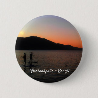 Stand up paddling in the sunset button