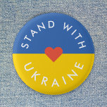 Stand with Ukraine Anti War Protest Ukrainian Flag Button<br><div class="desc">"Stand with Ukraine" collection to show solidarity and support anti war protests against the war in Ukraine. The design features a simple red heart over a Ukrainian Flag background in national colors of blue and yellow. I will donate 100% of my commission earned on this product range to support the...</div>