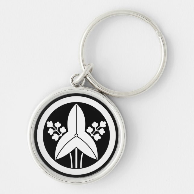 Standing arrowhead in a circle keychain (Front)