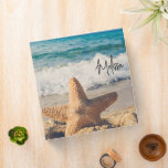 Starfish on a Sandy Beach Photograph 3 Ring Binder<br><div class="desc">A binder with a scenic photo. A big starfish set upright on a sandy beach. A beautiful blue sea with waves of white surf in the background.</div>