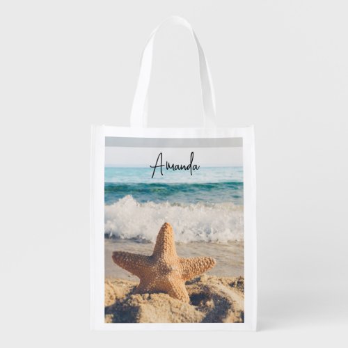 Starfish on a Sandy Beach Photograph Grocery Bag