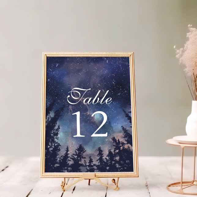Starry Night Forest Celestial Wedding Table Number (Starry Night Forest Wedding Table Numbers on a white wooden table in a golden frame.)