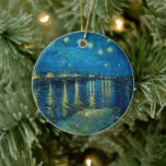 Starry Night Over the Rhône | Vincent van Gogh Ceramic Ornament<br><div class="desc">Starry Night Over the Rhône (1888) by Vincent van Gogh is a mesmerizing Post-Impressionist painting that captures a serene nighttime view of the Rhône River in Arles, France. The artwork features a deep blue sky adorned with shimmering golden stars and their reflections on the water. In the foreground, two figures...</div>