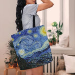 Starry Night | Vincent Van Gogh Tote Bag<br><div class="desc">Starry Night (1889) by Dutch artist Vincent Van Gogh. Original artwork is an oil on canvas depicting an energetic post-impressionist night sky in moody shades of blue and yellow. 

Use the design tools to add custom text or personalize the image.</div>