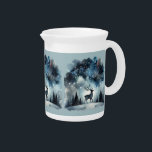 Starry Winter Night Deer Beverage Pitcher<br><div class="desc">A graceful stag stands beneath a shimmering winter sky, framed by snow-dusted pines and delicate bare trees. The deep midnight blues fade into frosty whites, while stars and snowflakes scatter like jewels across the heavens. This dreamy woodland scene captures the quiet wonder of a snowy night, blending cottagecore warmth with...</div>