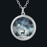Starry Winter Night Deer Silver Plated Necklace<br><div class="desc">A graceful stag stands beneath a shimmering winter sky, framed by snow-dusted pines and delicate bare trees. The deep midnight blues fade into frosty whites, while stars and snowflakes scatter like jewels across the heavens. This dreamy woodland scene captures the quiet wonder of a snowy night, blending cottagecore warmth with...</div>