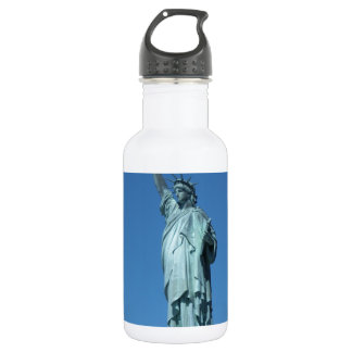 Statue of Liberty against a blue sky Water Bottle