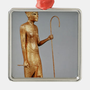 Statuette of king wearing the red crown of metal ornament