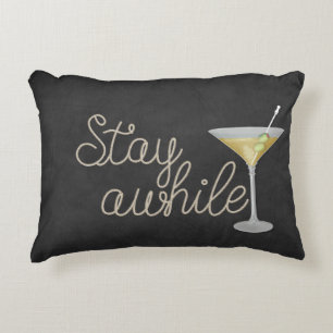 "stay awhile" rope on black accent pillow