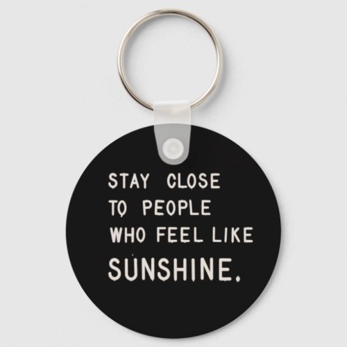 Stay close to people who feel like sunshine keychain