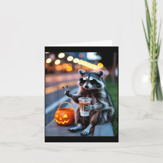 Stay feral raccoon drinking iced coffee halloween card