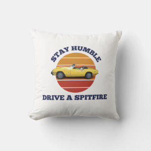 Stay humble, drive a triumph spitfire throw pillow
