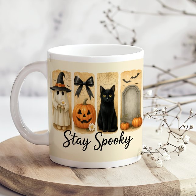 "Stay Spooky" Halloween Brush Stroke Cat  Coffee Mug ("Stay Spooky" Halloween Brush Stroke Cat Coffee Mug on a boho kitchen table with tiny flowers.)